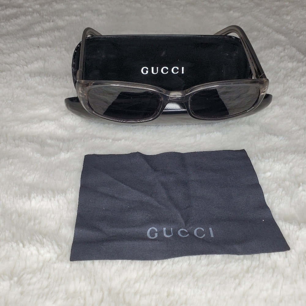 Gucci - Unisex Sunglasses - Clear Plastic Grey frame with Black Lens.